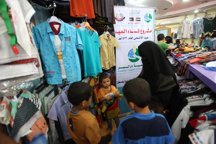 المجلس العلمي ينفذ مشروع كساء عيد الأضحى للعام 1436هـ صورة من المكان